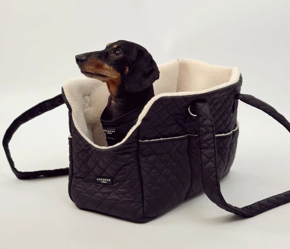 Cocopup Dog Carrier in Quilted Black. Combining ultimate comfort for your pup with effortless, chic functionality for you. Designed specifically for small dogs and puppies, this stylish tote-style carrier makes every outing easy. 