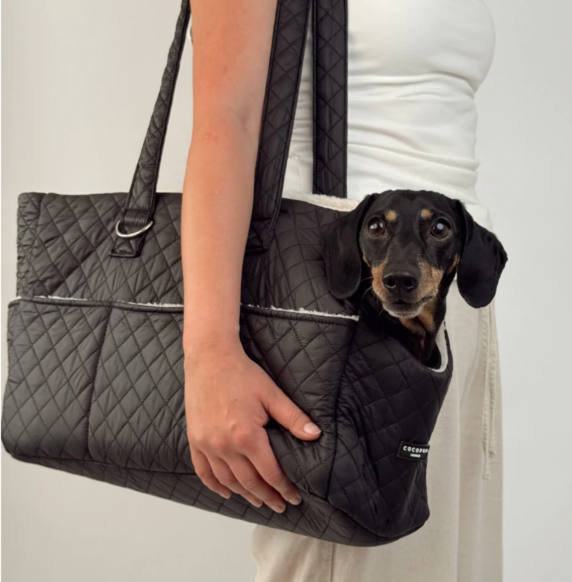 Cocopup Dog Carrier in Quilted Black.&nbsp;Combining ultimate comfort for your pup with effortless, chic functionality for you. Designed specifically for small dogs and puppies, this stylish tote-style carrier makes every outing easy.&nbsp;
