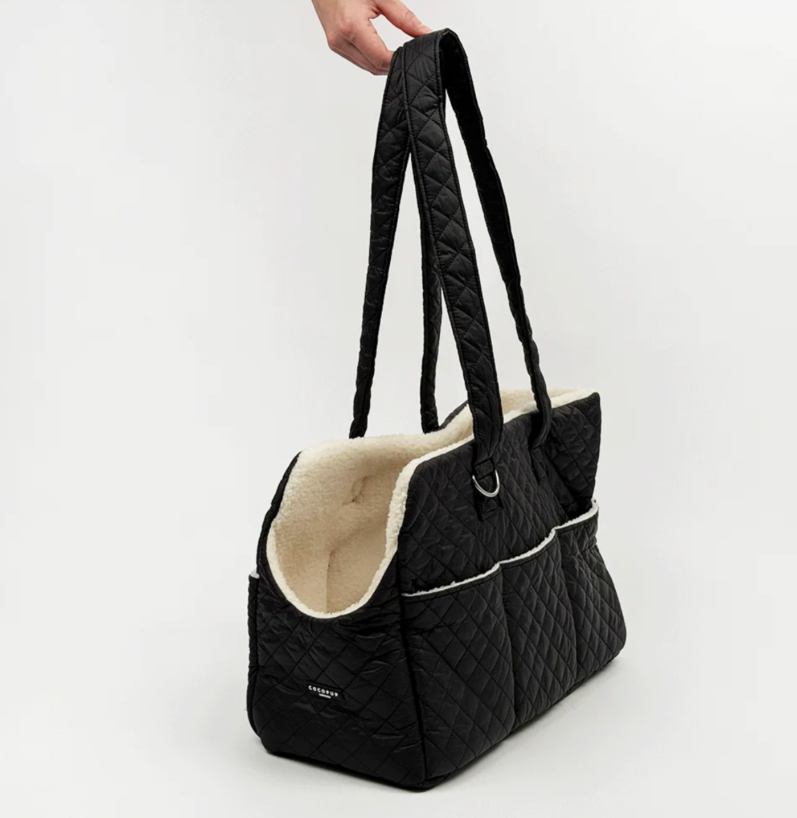 Cocopup Dog Carrier in Quilted Black.&nbsp;Combining ultimate comfort for your pup with effortless, chic functionality for you. Designed specifically for small dogs and puppies, this stylish tote-style carrier makes every outing easy.&nbsp;