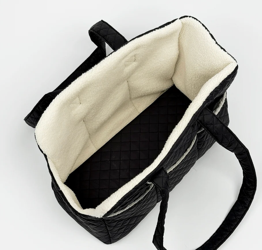 Cocopup Dog Carrier in Quilted Black.&nbsp;Combining ultimate comfort for your pup with effortless, chic functionality for you. Designed specifically for small dogs and puppies, this stylish tote-style carrier makes every outing easy.&nbsp;