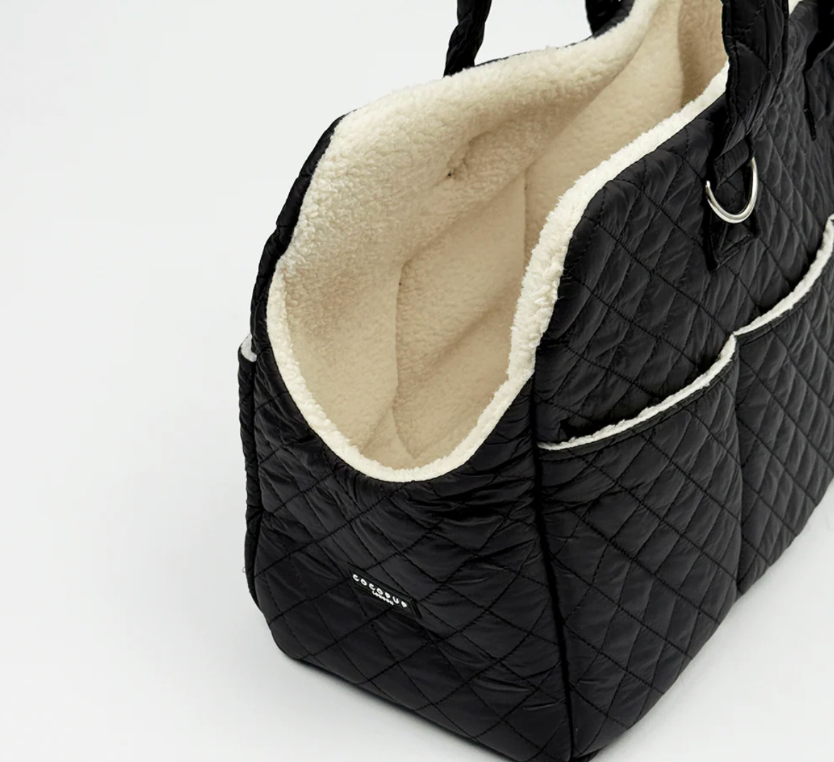 Cocopup Dog Carrier in Quilted Black.&nbsp;Combining ultimate comfort for your pup with effortless, chic functionality for you. Designed specifically for small dogs and puppies, this stylish tote-style carrier makes every outing easy.&nbsp;