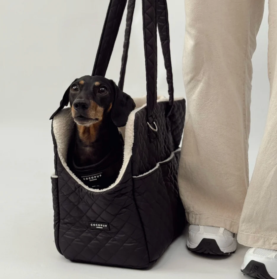 Cocopup Dog Carrier in Quilted Black.&nbsp;Combining ultimate comfort for your pup with effortless, chic functionality for you. Designed specifically for small dogs and puppies, this stylish tote-style carrier makes every outing easy.&nbsp;
